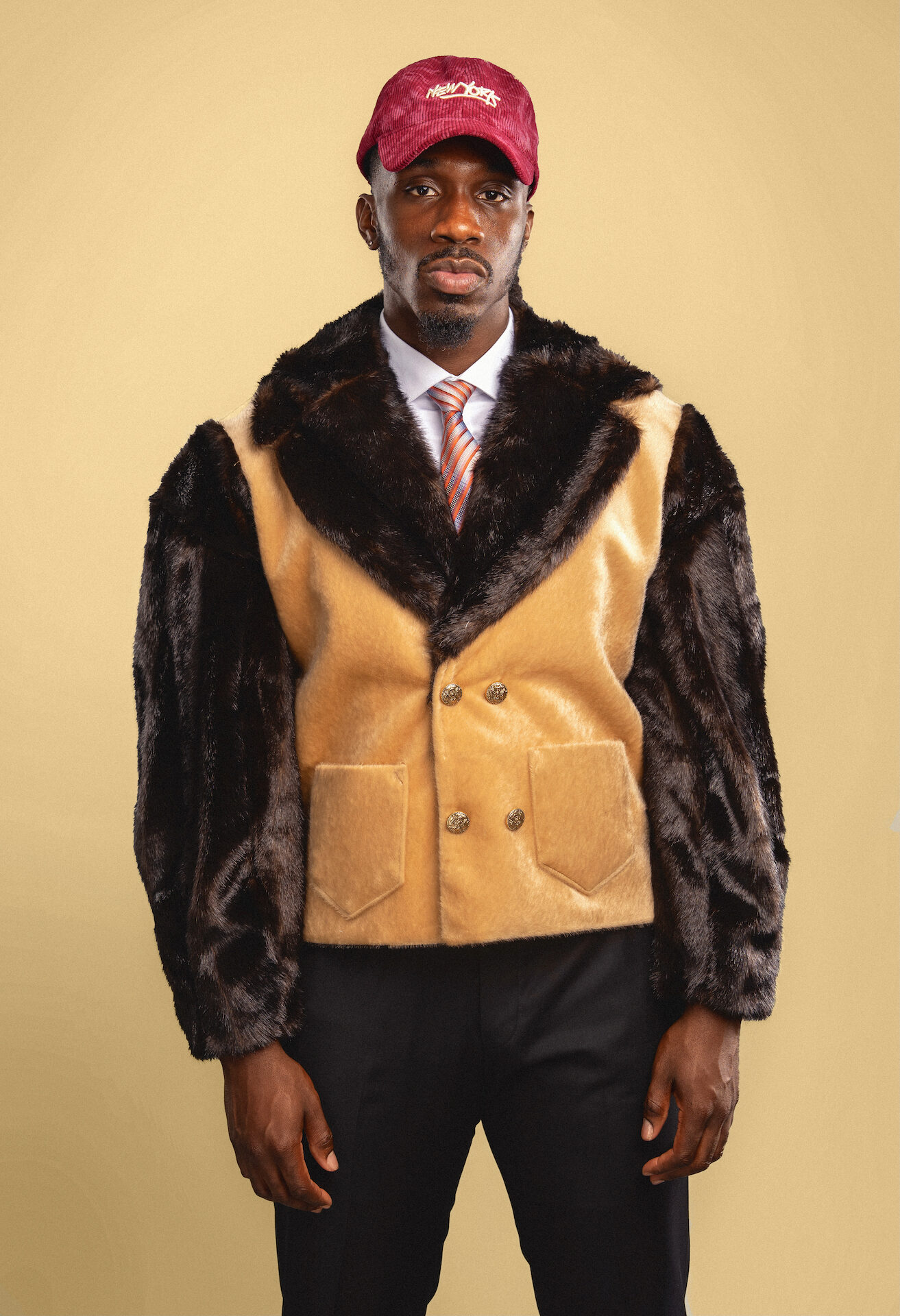 Named after the Swahili word for “lion,” the Simba Jacket embodies power, royalty, and resilience. With bold faux-fur textures reminiscent of a lion’s mane and the precision of sharp tailoring, the Simba channels king energy into everyday style.