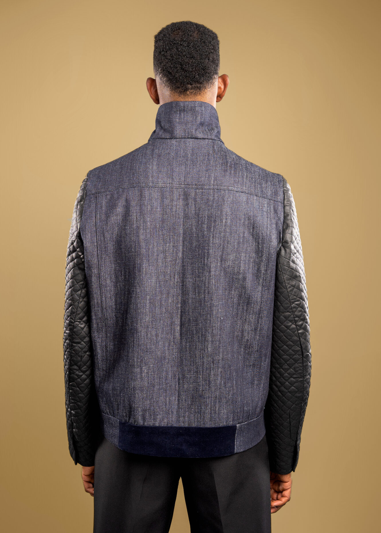 With a durable denim body, insulated quilted sleeves, and corduroy accents, The Weatherman is crafted to protect against the bite of cold weather, while maintaining effortless style. Engineered with Tesslo’s signature craftsmanship, it combines resilience and refinement in equal measure. Whether layered over suiting or styled for the streets, its versatility makes it a constant in your wardrobe.