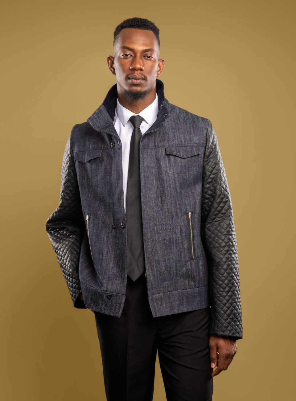 With a durable denim body, insulated quilted sleeves, and corduroy accents, The Weatherman is crafted to protect against the bite of cold weather, while maintaining effortless style. Engineered with Tesslo’s signature craftsmanship, it combines resilience and refinement in equal measure. Whether layered over suiting or styled for the streets, its versatility makes it a constant in your wardrobe.