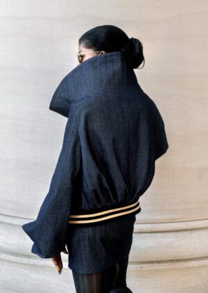 The TESSLETIC JACKET I reimagines denim through sculptural luxury. As the debut women’s piece in the Tessletic series, it merges tailored structure with athletic ease, equally suited for elevated daywear, travel, or evening styling.