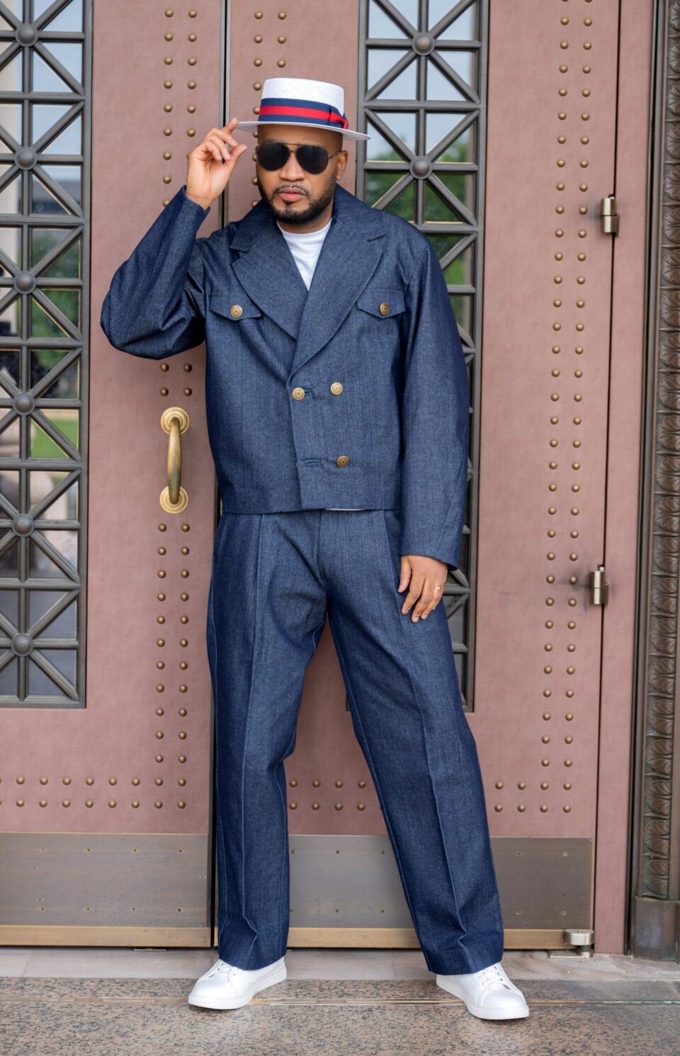 The Tessletic Marshal Set reimagines denim through the language of tailored authority. Cut in rich indigo cotton denim with clean architectural lines, this elevated set pairs a structured double-breasted jacket with relaxed pleated trousers for a look that feels equally athletic, refined, and commanding. Designed for the modern man who moves between influence, leisure, and presence with ease.