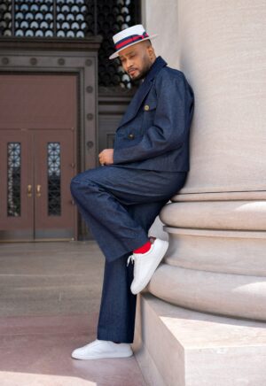 The Tessletic Marshal Set reimagines denim through the language of tailored authority. Cut in rich indigo cotton denim with clean architectural lines, this elevated set pairs a structured double-breasted jacket with relaxed pleated trousers for a look that feels equally athletic, refined, and commanding. Designed for the modern man who moves between influence, leisure, and presence with ease.