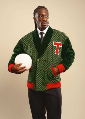 The Atlético celebrates the prestige of athletic talent and the spirit of champions. Inspired by classic varsity style and designer Tessy Oliseh-Amaize’s football family heritage, it bridges the worlds of sport and style. Handmade in the USA with cotton Ankara fabric and plush velvet, this double-breasted jacket is designed for the man who values both performance and presence.